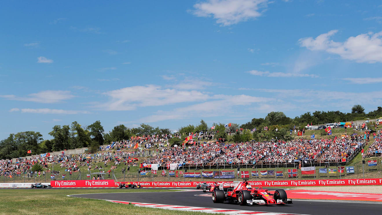Sebastian Vettel (GER) Ferrari SF70-H leads at the start of the race at Formula One World Championship, Rd11, Hungarian Grand Prix, Race, Hungaroring, Hungary, Sunday 30 July 2017. © Sutton Images