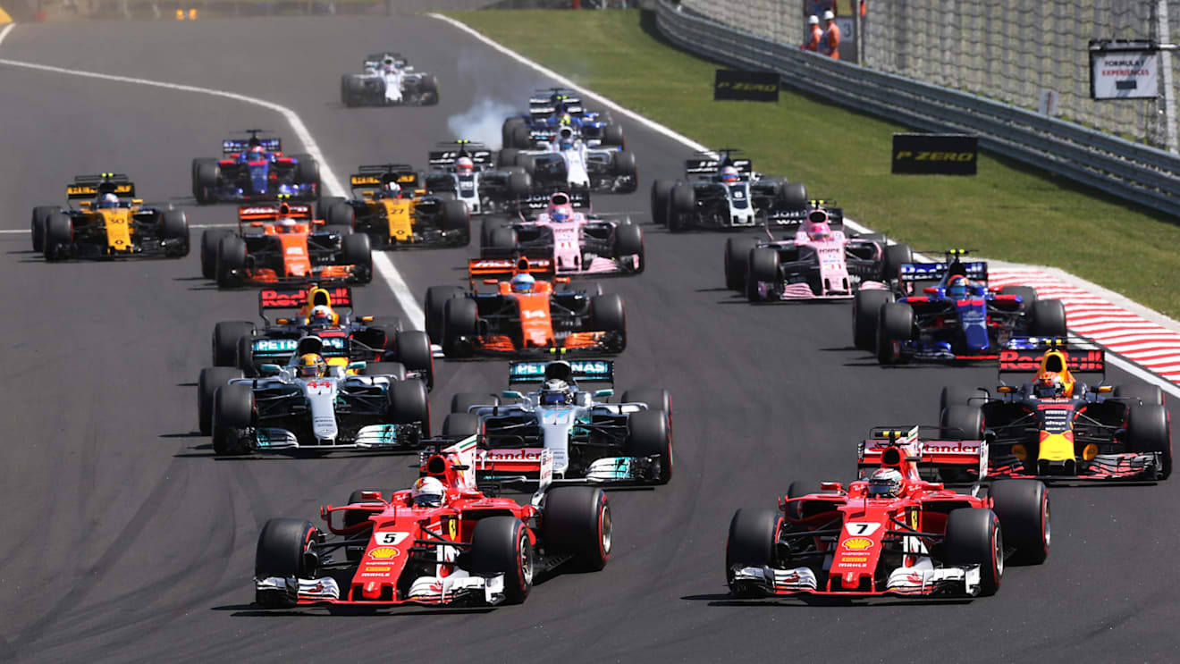Sebastian Vettel (GER) Ferrari SF70-H leads at the start of the race at Formula One World Championship, Rd11, Hungarian Grand Prix, Race, Hungaroring, Hungary, Sunday 30 July 2017. © Sutton Images