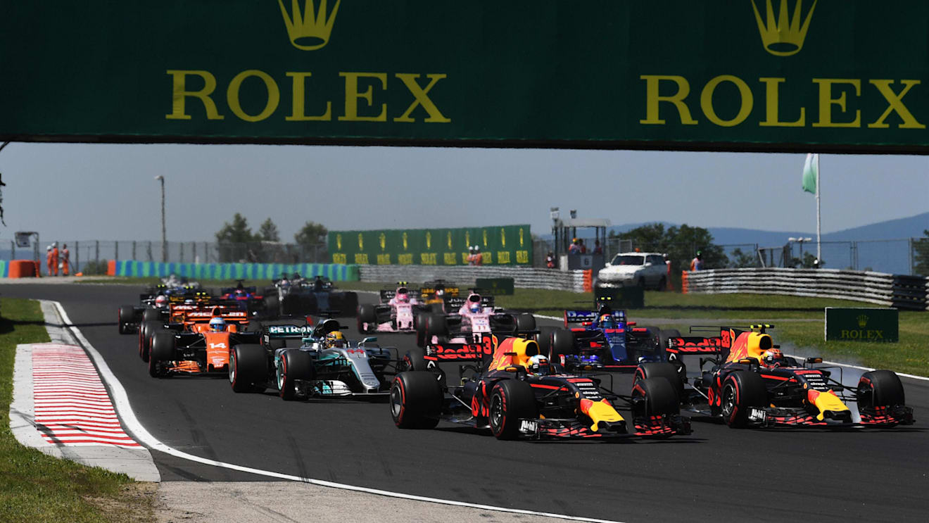 Daniel Ricciardo (AUS) Red Bull Racing RB13 and Max Verstappen (NED) Red Bull Racing RB13 at the start of the race at Formula One World Championship, Rd11, Hungarian Grand Prix, Race, Hungaroring, Hungary, Sunday 30 July 2017. © Sutton Images
