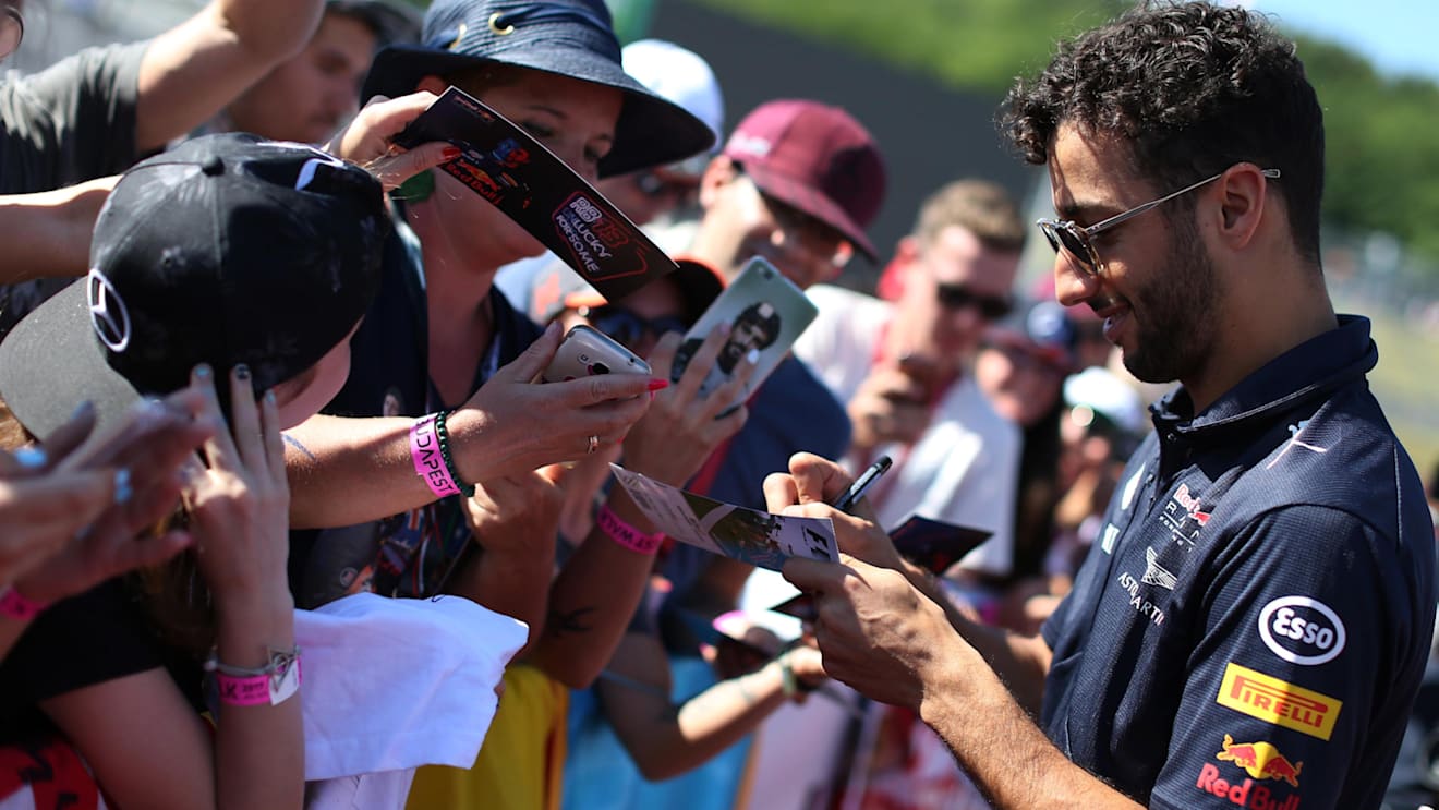 Daniel Ricciardo (AUS) Red Bull Racing signs autographs for the fans at Formula One World Championship, Rd11, Hungarian Grand Prix, Race, Hungaroring, Hungary, Sunday 30 July 2017. © Sutton Images