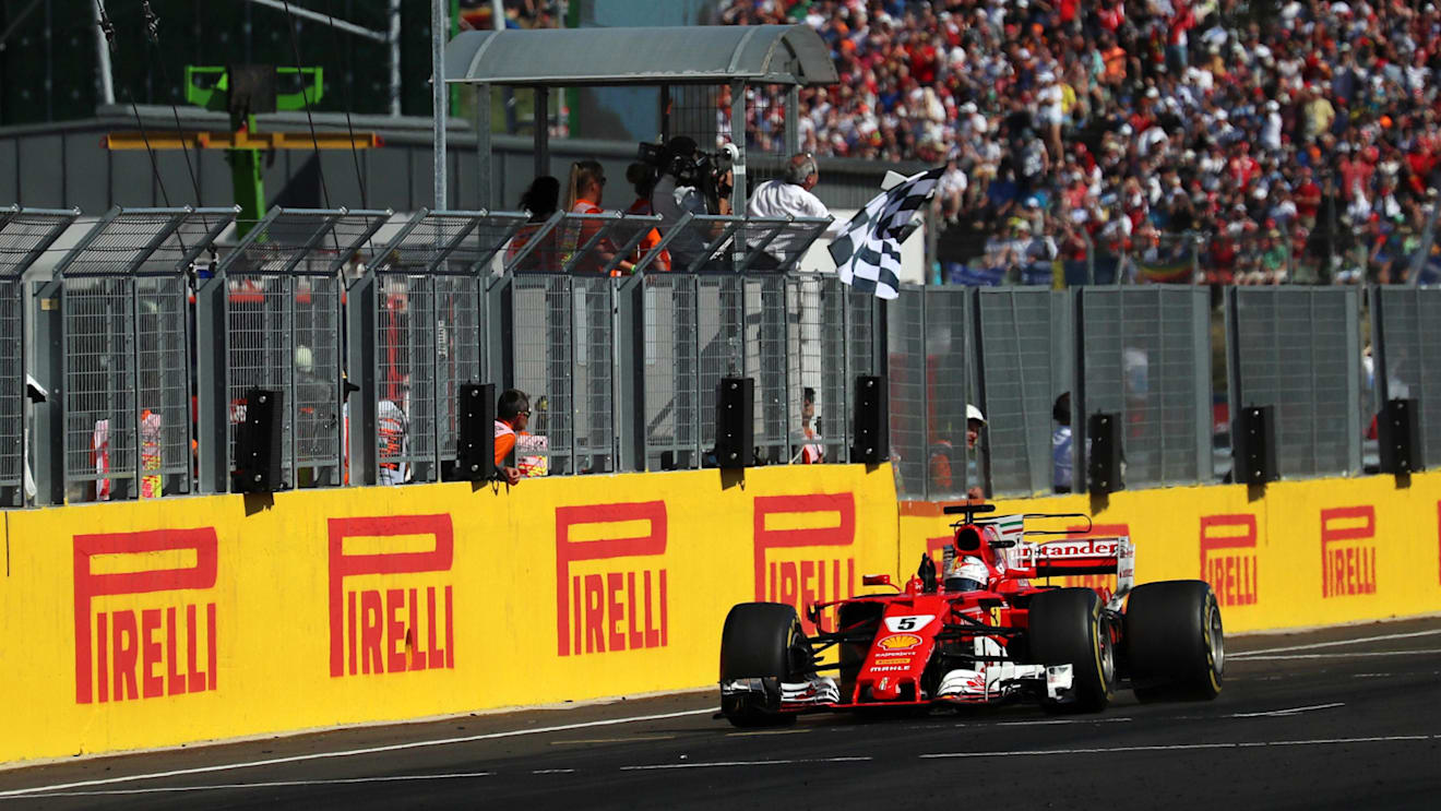 Race winner Sebastian Vettel (GER) Ferrari SF70-H takes the chequered flag at Formula One World Championship, Rd11, Hungarian Grand Prix, Race, Hungaroring, Hungary, Sunday 30 July 2017. © Sutton Images