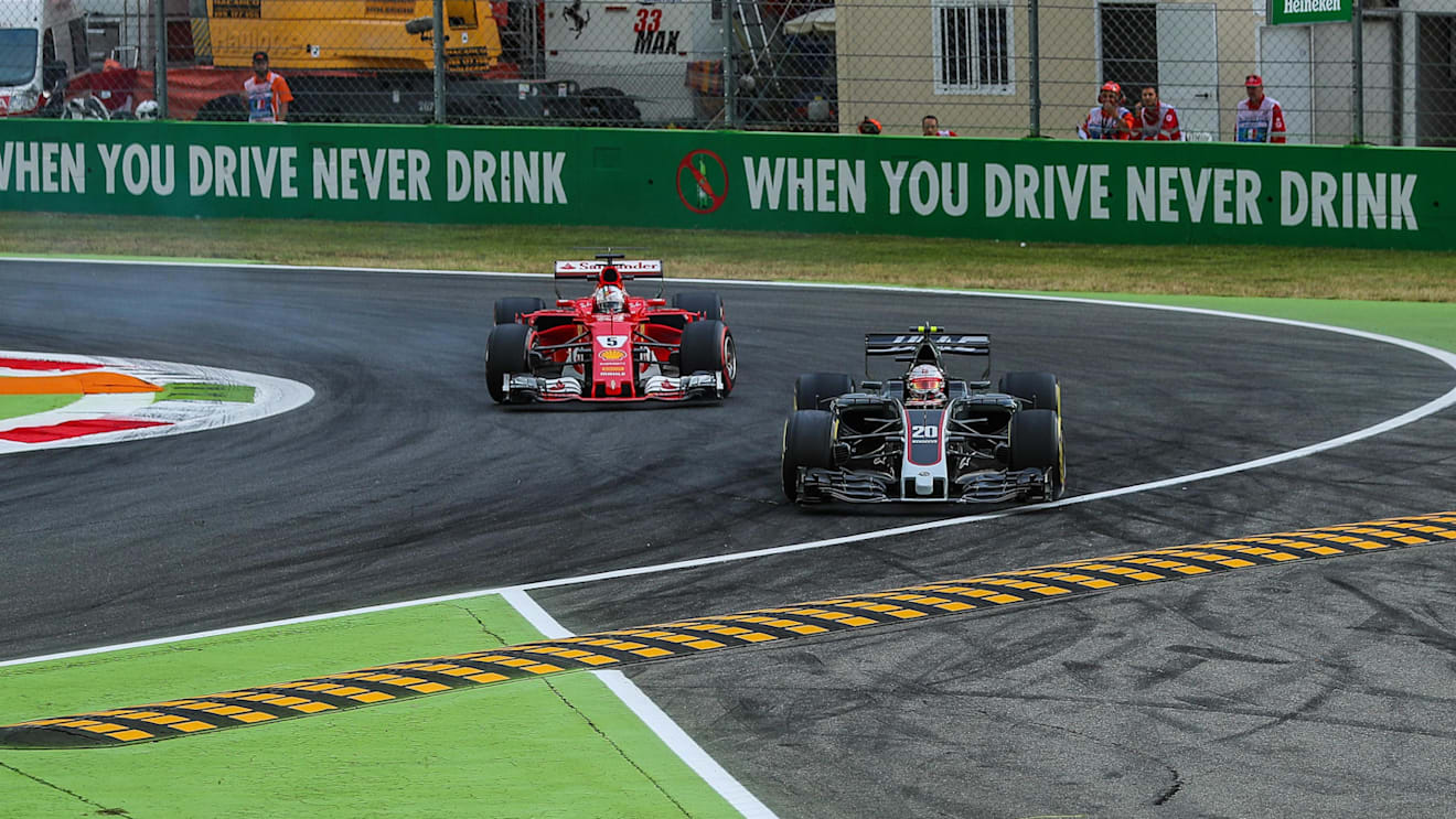 Kevin Magnussen (DEN) Haas VF-17 locks up and runs wide alongside Sebastian Vettel (GER) Ferrari SF70-H at Formula One World Championship, Rd13, Italian Grand Prix, Practice, Monza, Italy, Friday 1 September 2017. © Sutton Images