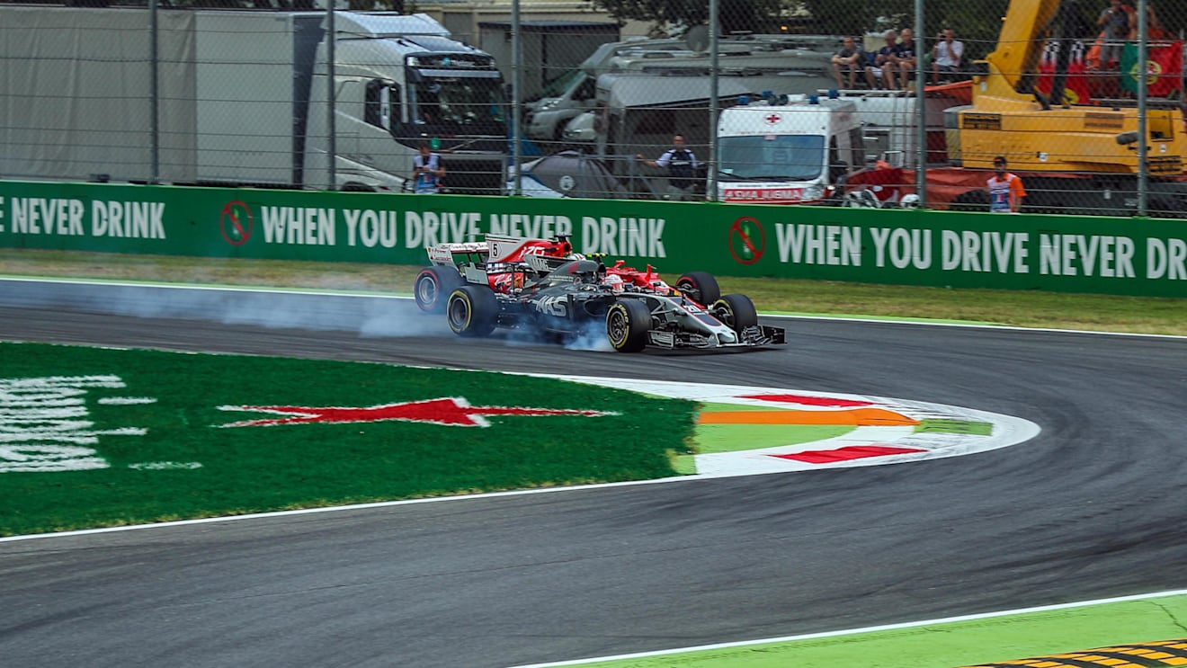 Kevin Magnussen (DEN) Haas VF-17 locks up and runs wide alongside Sebastian Vettel (GER) Ferrari SF70-H at Formula One World Championship, Rd13, Italian Grand Prix, Practice, Monza, Italy, Friday 1 September 2017. © Sutton Images