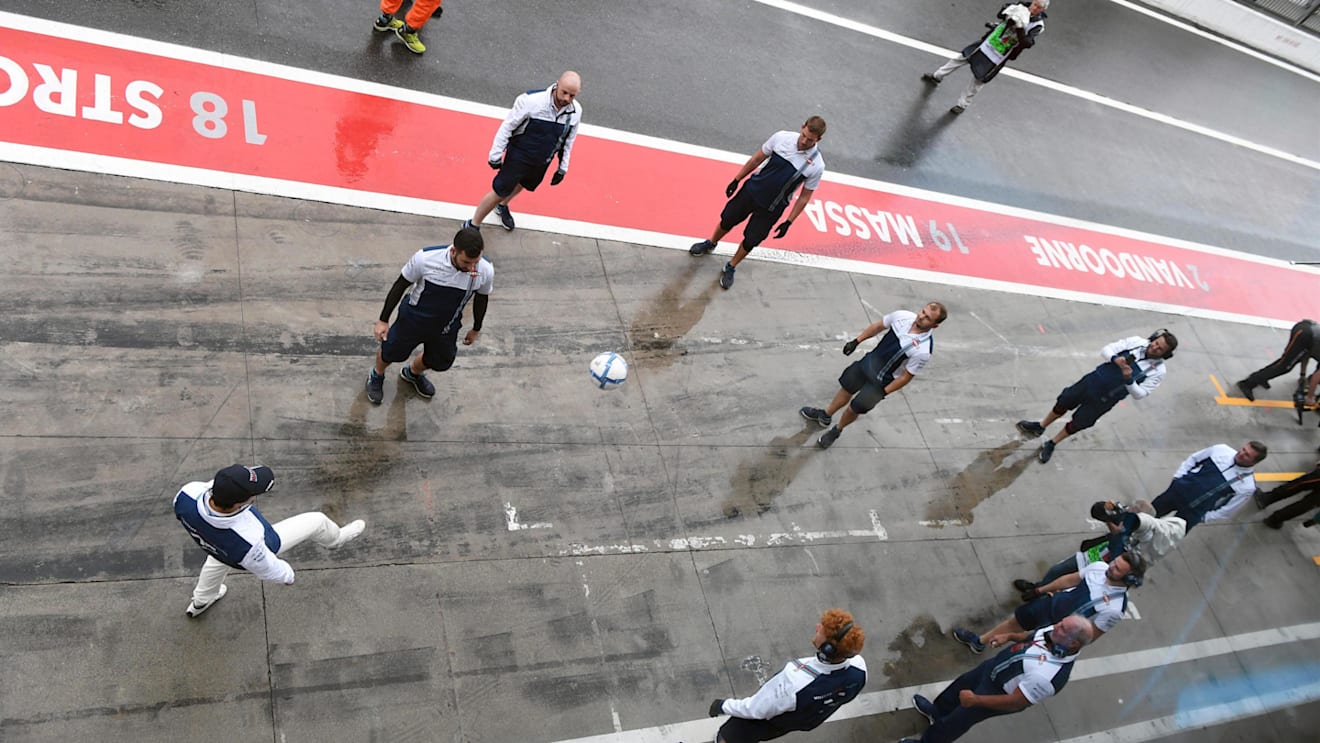 Felipe Massa (BRA) Williams and the Williams mechanics play football in pit lane at Formula One World Championship, Rd13, Italian Grand Prix, Qualifying, Monza, Italy, Saturday 2 September 2017. © Sutton Images