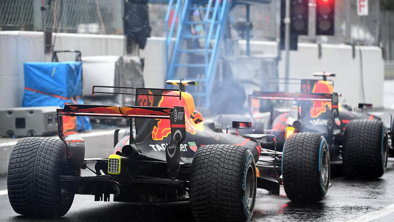 Verstappen (NED) Red Bull Racing RB13 and Ricciardo (AUS) Red Bull Racing RB13 waits at the red light at the end of pit lane at Formula One World Championship, Rd13, Italian Grand Prix, Qualifying, Monza, Italy, Saturday 2 September 2017. © Sutton Images