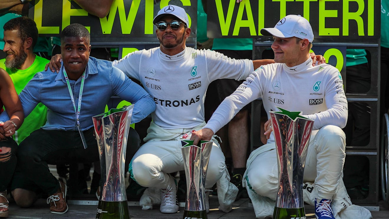Race winner Lewis Hamilton (GBR) Mercedes AMG F1 and Valtteri Bottas (FIN) Mercedes AMG F1 celebrate with the team and the trophies at Formula One World Championship, Rd13, Italian Grand Prix, Race, Monza, Italy, Sunday 3 September 2017. © Sutton Images