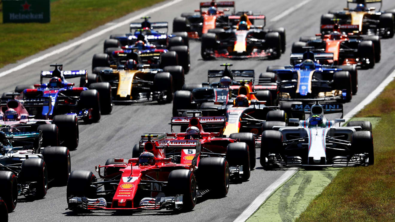 Raikkonen (FIN) Ferrari SF70-H and Vettel (GER) Ferrari SF70-H as Massa (BRA) Williams FW40 runs wide at the start of the race at Formula One World Championship, Rd13, Italian Grand Prix, Race, Monza, Italy, Sunday 3 September 2017. © Sutton Images
