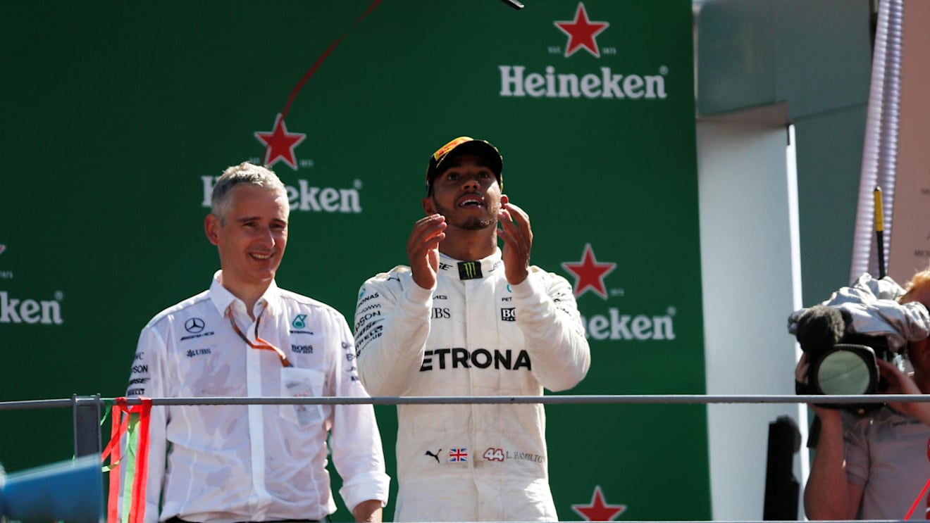 Race winner Lewis Hamilton (GBR) Mercedes AMG F1 celebrates on the podium with the his mobile phone at Formula One World Championship, Rd13, Italian Grand Prix, Race, Monza, Italy, Sunday 3 September 2017. © Sutton Images