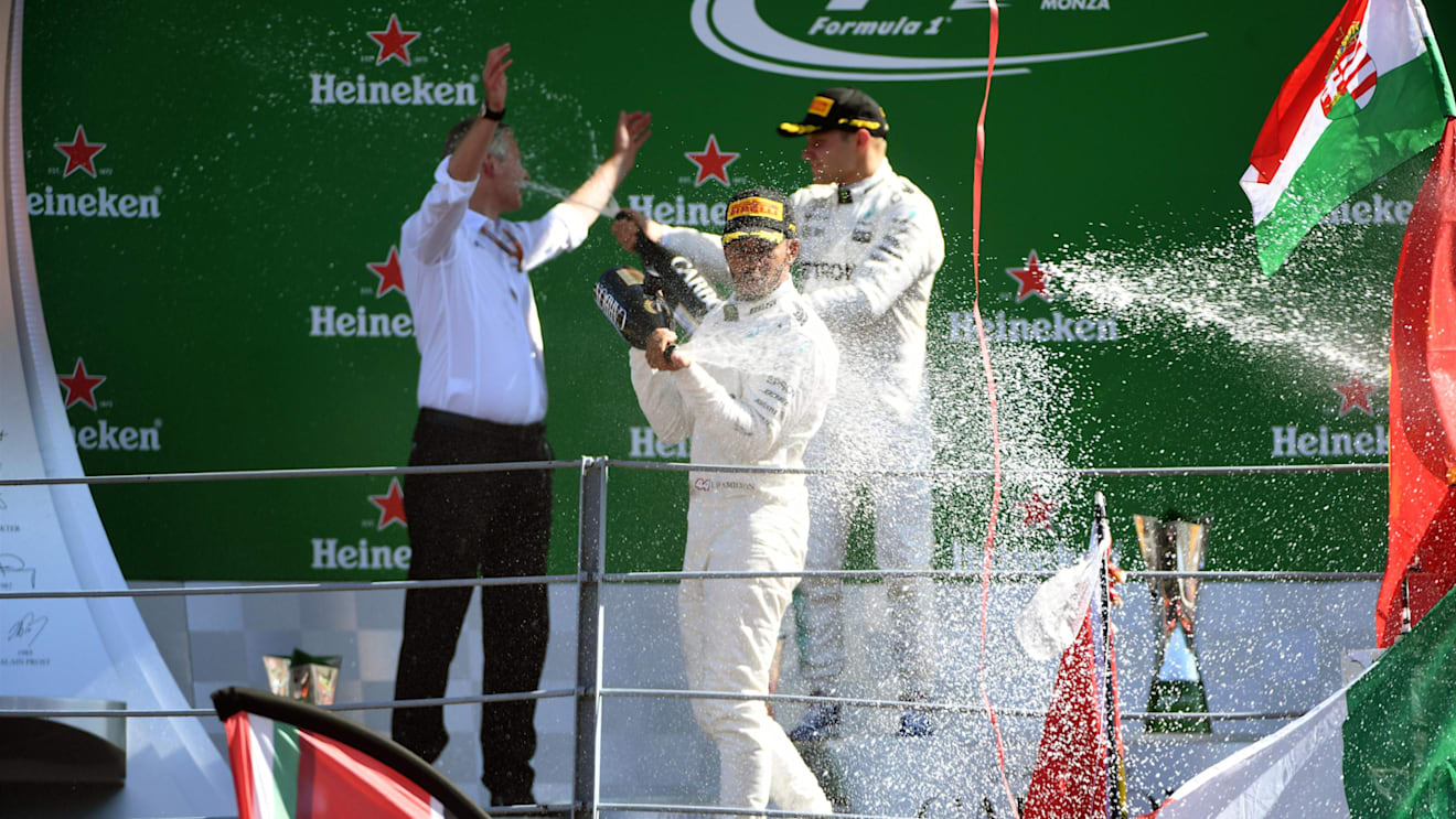 Lewis Hamilton (GBR) Mercedes AMG F1 and Valtteri Bottas (FIN) Mercedes AMG F1 celebrate on the podium with the champagne at Formula One World Championship, Rd13, Italian Grand Prix, Race, Monza, Italy, Sunday 3 September 2017. © Sutton Images