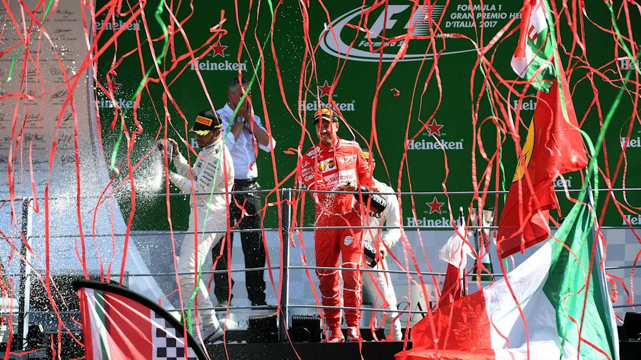 Bottas (FIN) Mercedes AMG F1, Hamilton (GBR) Mercedes AMG F1 and Vettel (GER) Ferrari celebrate on the podium with the champagne at Formula One World Championship, Rd13, Italian Grand Prix, Race, Monza, Italy, Sunday 3 September 2017. © Sutton Images