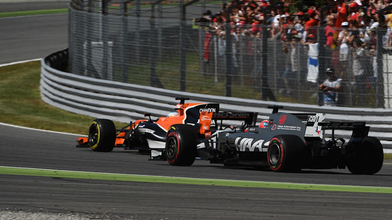 Fernando Alonso (ESP) McLaren MCL32 and Romain Grosjean (FRA) Haas VF-17 at Formula One World Championship, Rd13, Italian Grand Prix, Race, Monza, Italy, Sunday 3 September 2017. © Sutton Images