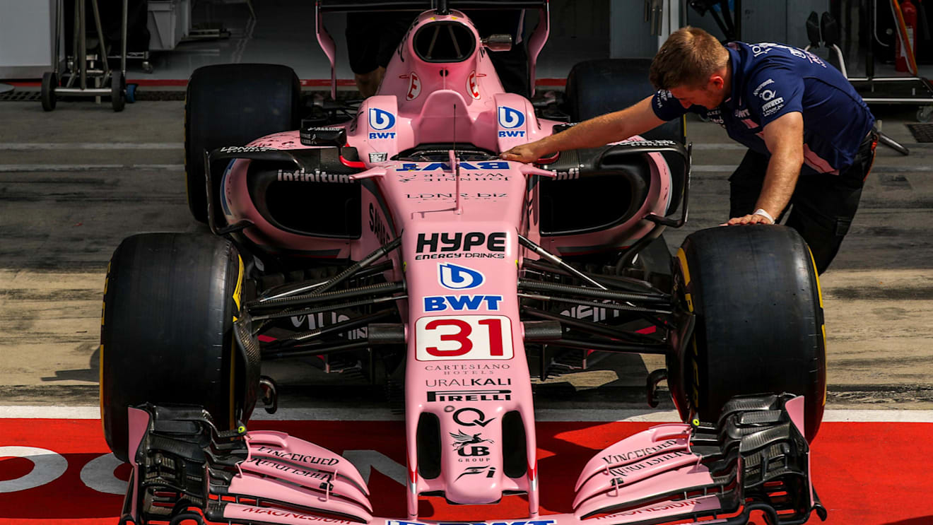 Force India mechanic pushes the car of Esteban Ocon (FRA) Force India VJM10 at Formula One World Championship, Rd13, Italian Grand Prix, Preparations, Monza, Italy, Thursday 31 August 2017. © Sutton Images