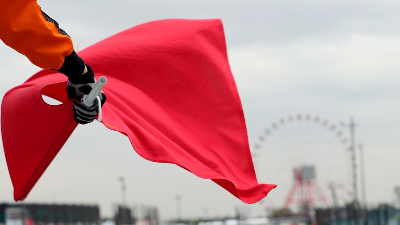 Marshal waves the red flag at Formula One World Championship, Rd16, Japanese Grand Prix, Practice, Suzuka, Japan, Friday 6 October 2017. © Kym Illman/Sutton Images