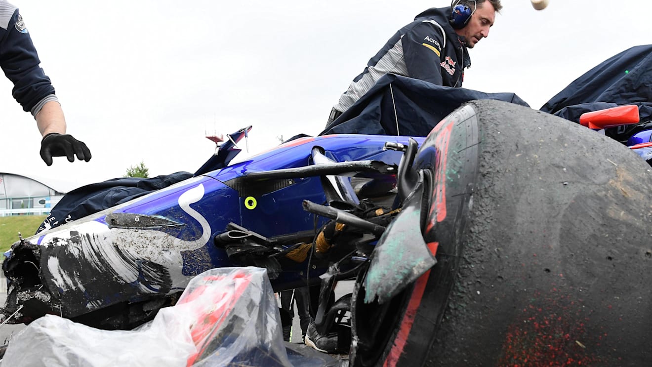 The crashed car of Carlos Sainz (ESP) Scuderia Toro Rosso STR12 is recovered after FP1 at Formula One World Championship, Rd16, Japanese Grand Prix, Practice, Suzuka, Japan, Friday 6 October 2017. © Rubio/Sutton Images