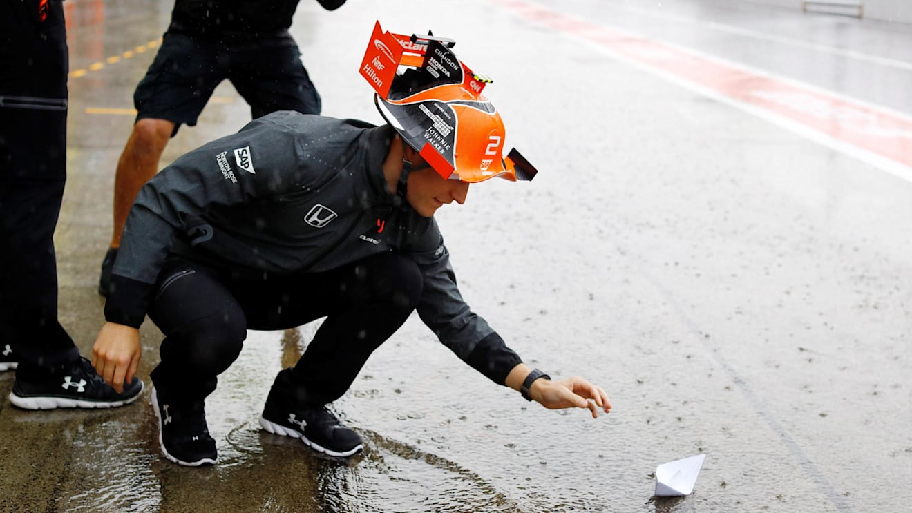 Stoffel Vandoorne (BEL) McLaren floats a paper boat in a flooded pit lane at Formula One World Championship, Rd16, Japanese Grand Prix, Practice, Suzuka, Japan, Friday 6 October 2017. © Rubio/Sutton Images