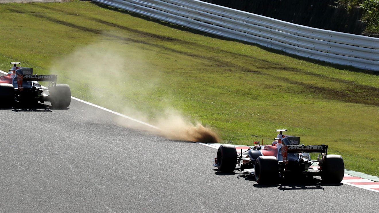 Fernando Alonso (ESP) McLaren MCL32 and Stoffel Vandoorne (BEL) McLaren MCL32 runs wide onto the grass at Formula One World Championship, Rd16, Japanese Grand Prix, Race, Suzuka, Japan, Sunday 8 October 2017. © Kym Illman/Sutton Images