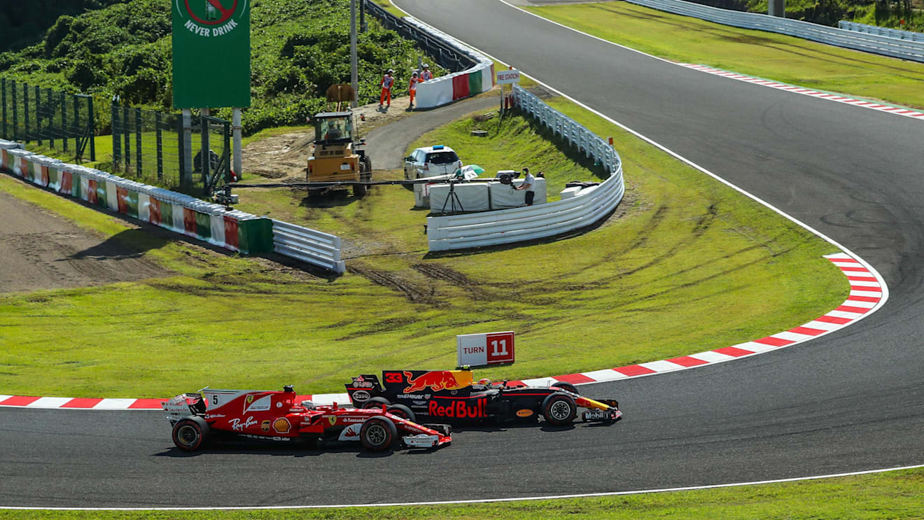 Sebastian Vettel (GER) Ferrari SF70-H and Max Verstappen (NED) Red Bull Racing RB13 battle for position at Formula One World Championship, Rd16, Japanese Grand Prix, Race, Suzuka, Japan, Sunday 8 October 2017. © Kym Illman/Sutton Images