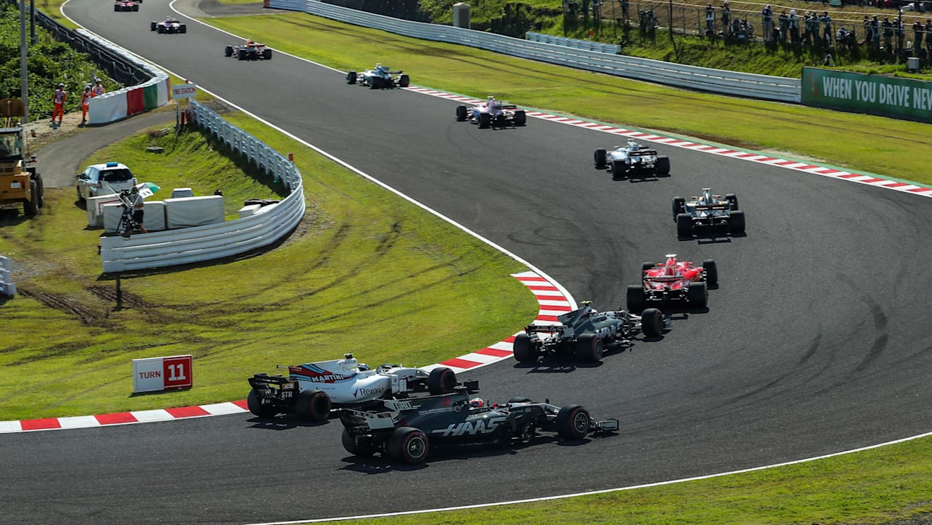 Romain Grosjean (FRA) Haas VF-17 and Lance Stroll (CDN) Williams FW40 battle for position at the start of the race at Formula One World Championship, Rd16, Japanese Grand Prix, Race, Suzuka, Japan, Sunday 8 October 2017. © Kym Illman/Sutton Images