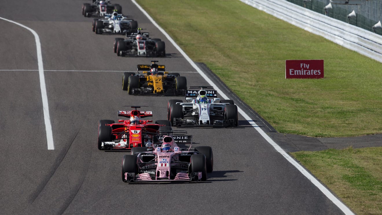 Sergio Perez (MEX) Force India VJM10 and Sebastian Vettel (GER) Ferrari SF70-H battle for position at Formula One World Championship, Rd16, Japanese Grand Prix, Race, Suzuka, Japan, Sunday 8 October 2017. © Manuel Goria/Sutton Images