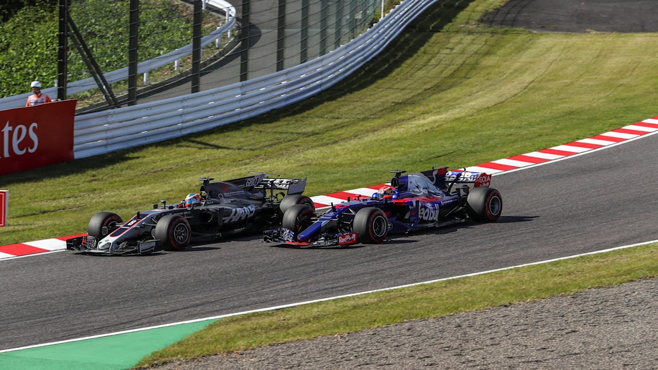 Romain Grosjean (FRA) Haas VF-17 and Pierre Gasly (FRA) Scuderia Toro Rosso STR12 battle at Formula One World Championship, Rd16, Japanese Grand Prix, Race, Suzuka, Japan, Sunday 8 October 2017. © Manuel Goria/Sutton Images