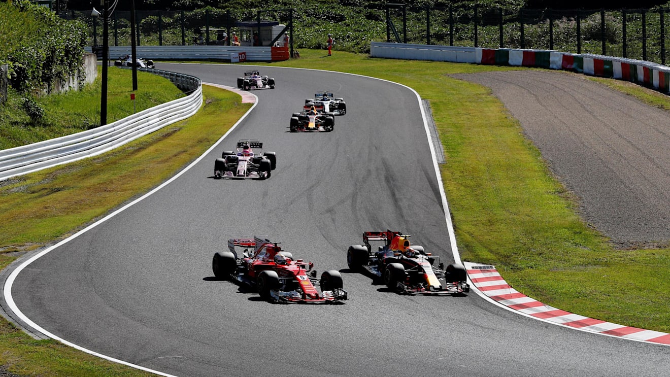 Max Verstappen (NED) Red Bull Racing RB13 passes Sebastian Vettel (GER) Ferrari SF70-H at Formula One World Championship, Rd16, Japanese Grand Prix, Race, Suzuka, Japan, Sunday 8 October 2017. © Kym Illman/Sutton Images