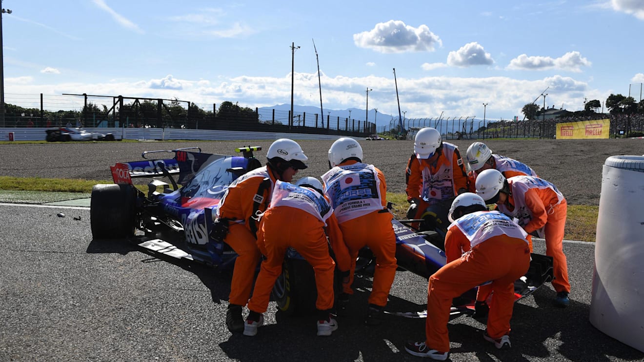 Marshals recover the car of race retiree Carlos Sainz (ESP) Scuderia Toro Rosso STR12 at Formula One World Championship, Rd16, Japanese Grand Prix, Race, Suzuka, Japan, Sunday 8 October 2017. © Mark Sutton/Sutton Images