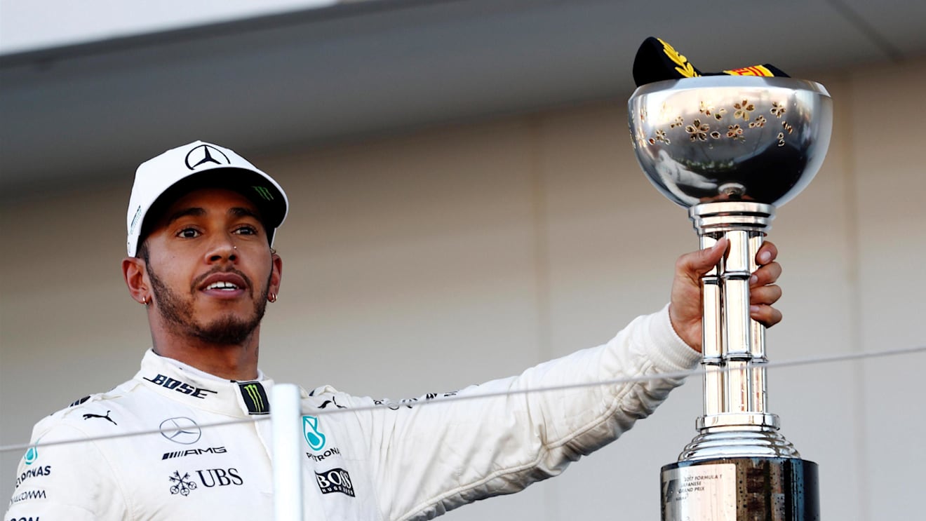 Race winner Lewis Hamilton (GBR) Mercedes AMG F1 celebrates on the podium with the trophy at Formula One World Championship, Rd16, Japanese Grand Prix, Race, Suzuka, Japan, Sunday 8 October 2017. © Glenn Dunbar/LAT/Sutton Images