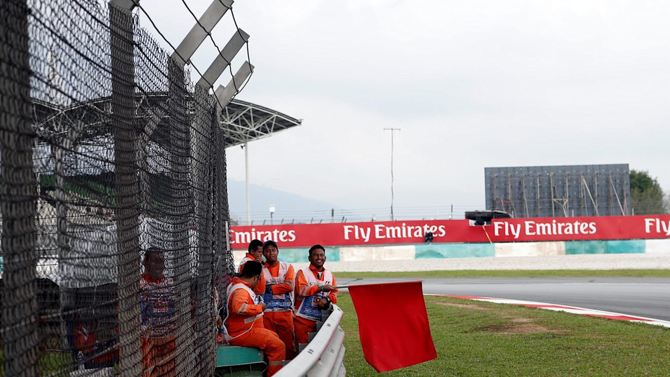 Marshal waves the red flag at Formula One World Championship, Rd15, Malaysian Grand Prix, Practice, Sepang, Malaysia, Friday 29 September 2017. © Manuel Goria/Sutton Images