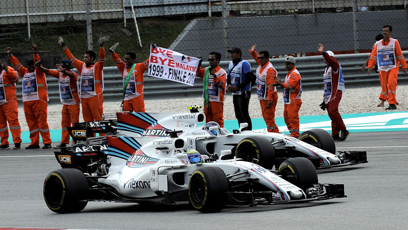 Felipe Massa (BRA) Williams FW40 and Lance Stroll (CDN) Williams FW40 celebrate with the race marshals at the end of the race at Formula One World Championship, Rd15, Malaysian Grand Prix, Race, Sepang, Malaysia, Sunday 1 October 2017. © Rubio/Sutton Images