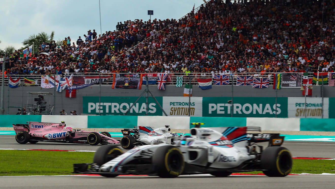 Esteban Ocon (FRA) Force India VJM10 and Felipe Massa (BRA) Williams FW40 battle for position at Formula One World Championship, Rd15, Malaysian Grand Prix, Race, Sepang, Malaysia, Sunday 1 October 2017. © Kym Illman/Sutton Images