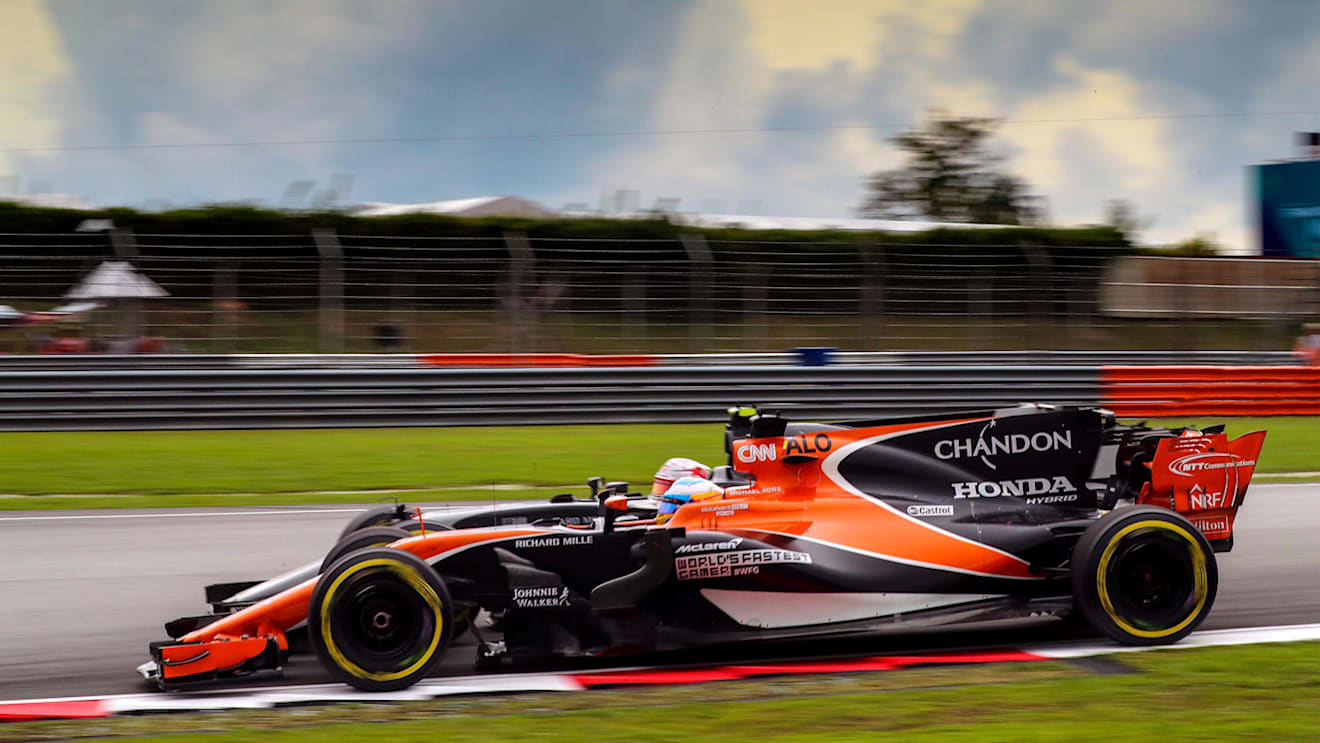 Fernando Alonso (ESP) McLaren MCL32 and Kevin Magnussen (DEN) Haas VF-17 battle at Formula One World Championship, Rd15, Malaysian Grand Prix, Race, Sepang, Malaysia, Sunday 1 October 2017. © Kym Illman/Sutton Images