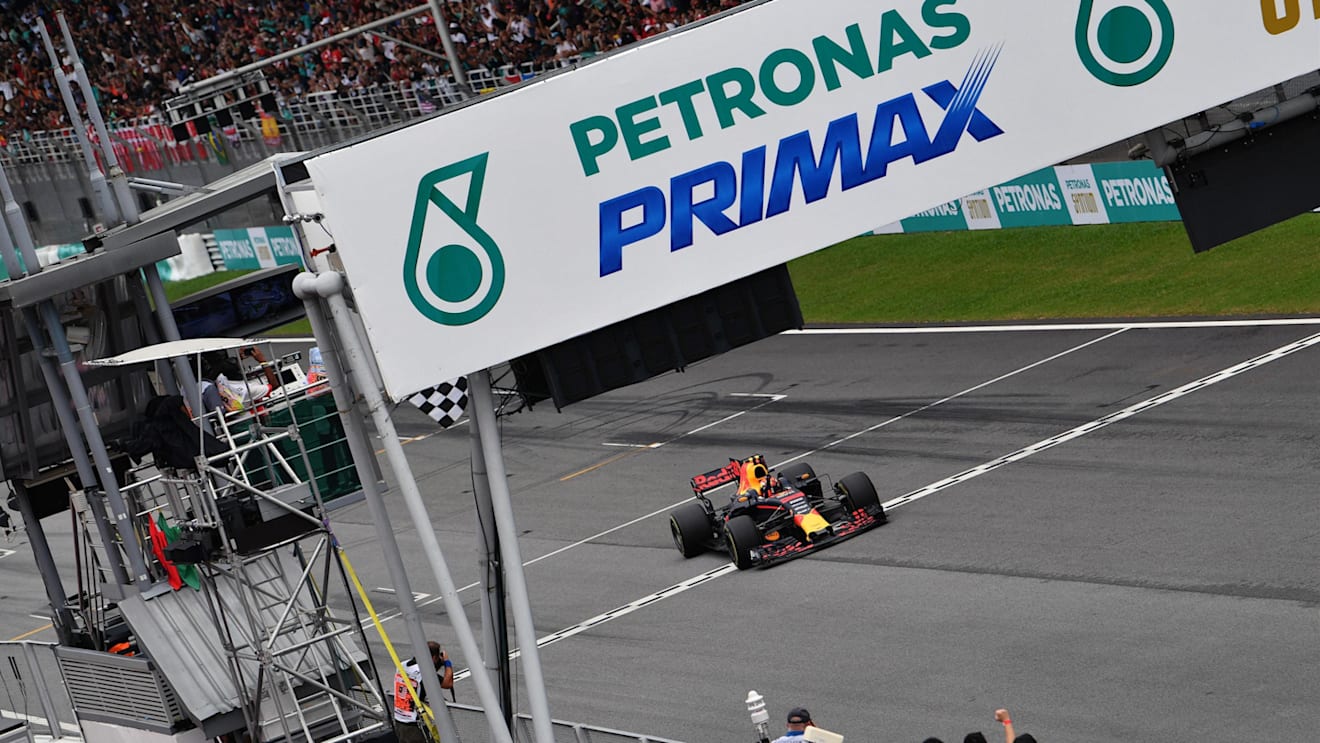 Race winner Max Verstappen (NED) Red Bull Racing RB13 crosses the line and takes the chequered flag at Formula One World Championship, Rd15, Malaysian Grand Prix, Race, Sepang, Malaysia, Sunday 1 October 2017. © Mark Sutton/Sutton Images