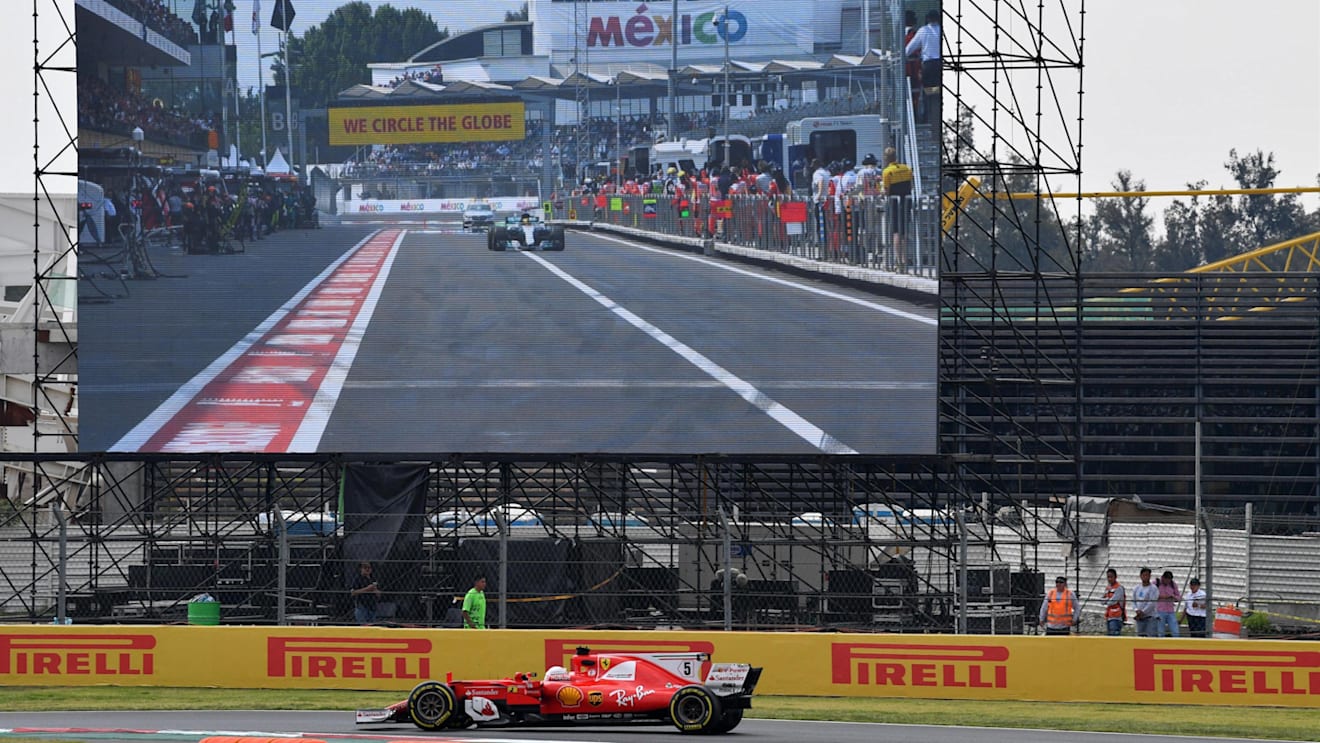 Sebastian Vettel (GER) Ferrari SF70-H on lap 2 and Lewis Hamilton (GBR) Mercedes-Benz F1 W08 Hybrid in pit lane on the screen at Formula One World Championship, Rd18, Mexican Grand Prix, Race, Circuit Hermanos Rodriguez, Mexico City, Mexico, Sunday 29 October 2017. © Mark Sutton/Sutton Images
