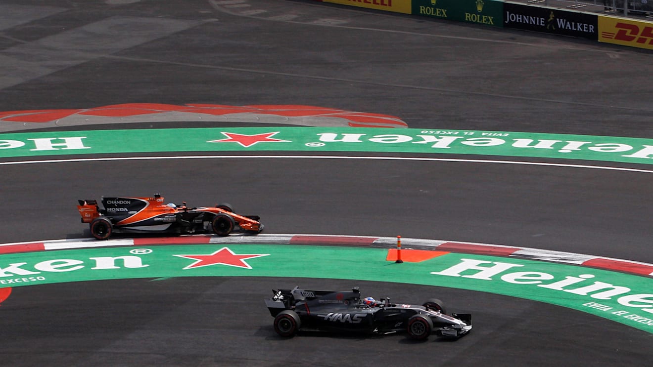 Fernando Alonso (ESP) McLaren MCL32 and Romain Grosjean (FRA) Haas VF-17 battle at Formula One World Championship, Rd18, Mexican Grand Prix, Race, Circuit Hermanos Rodriguez, Mexico City, Mexico, Sunday 29 October 2017. © Manuel Goria/Sutton Images