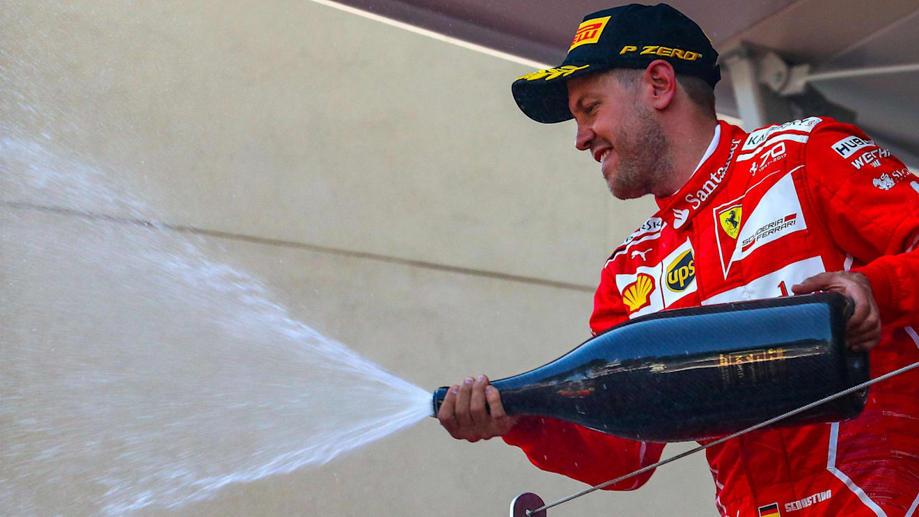 Race winner Sebastian Vettel (GER) Ferrari celebrates on the podium with the champagne at Formula One World Championship, Rd6, Monaco Grand Prix, Race, Monte-Carlo, Monaco, Sunday 28 May 2017. © Sutton Images