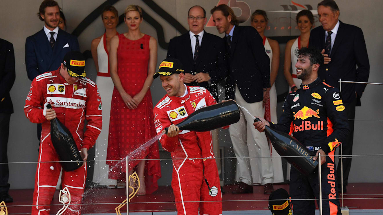 Kimi Raikkonen (FIN) Ferrari, race winner Sebastian Vettel (GER) Ferrari and Daniel Ricciardo (AUS) Red Bull Racing celebrate on the podium with the champagne at Formula One World Championship, Rd6, Monaco Grand Prix, Race, Monte-Carlo, Monaco, Sunday 28 May 2017. © Sutton Images