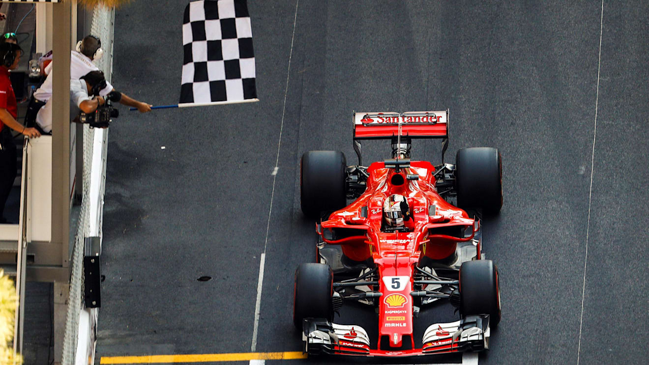 Race winner Sebastian Vettel (GER) Ferrari SF70-H taks the chequered flag at Formula One World Championship, Rd6, Monaco Grand Prix, Race, Monte-Carlo, Monaco, Sunday 28 May 2017. © Sutton Images