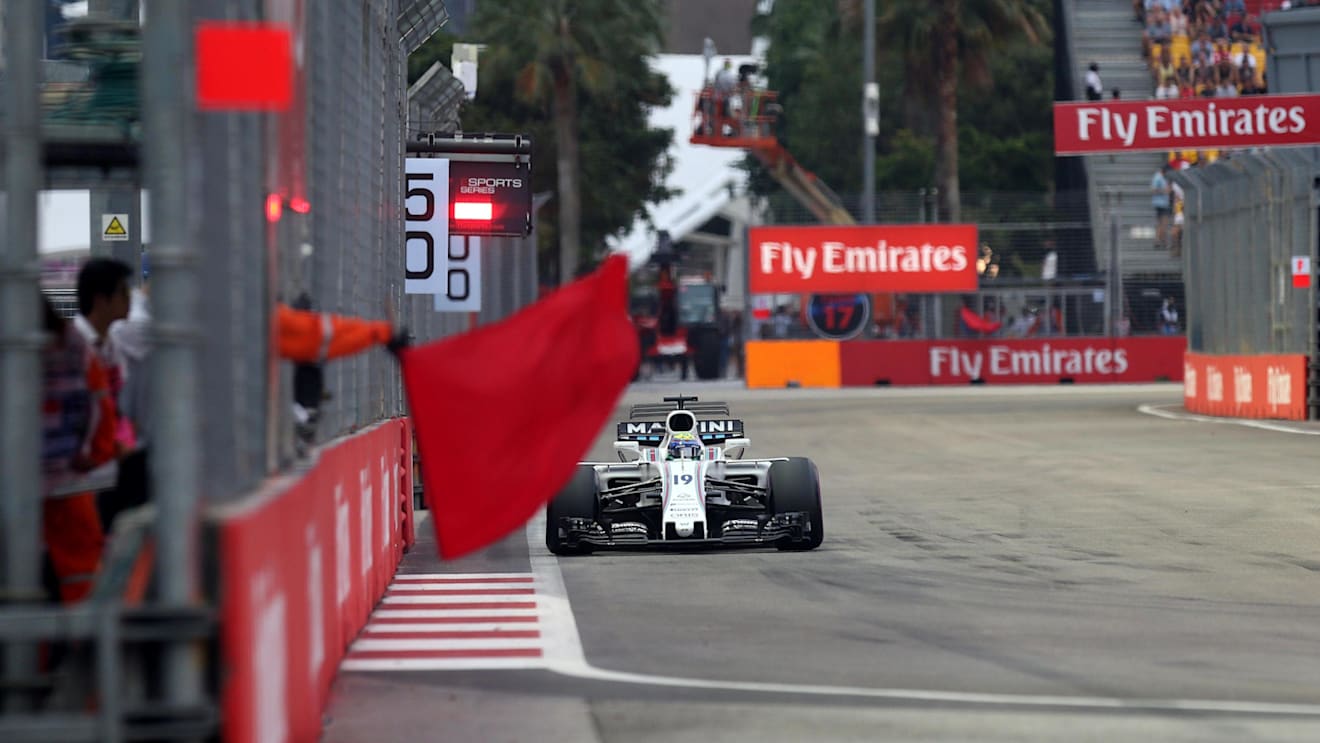 Felipe Massa (BRA) Williams FW40 and Marshal waves a red flag at Formula One World Championship, Rd14, Singapore Grand Prix, Qualifying, Marina Bay Street Circuit, Singapore, Saturday 16 September 2017. © Sutton Images