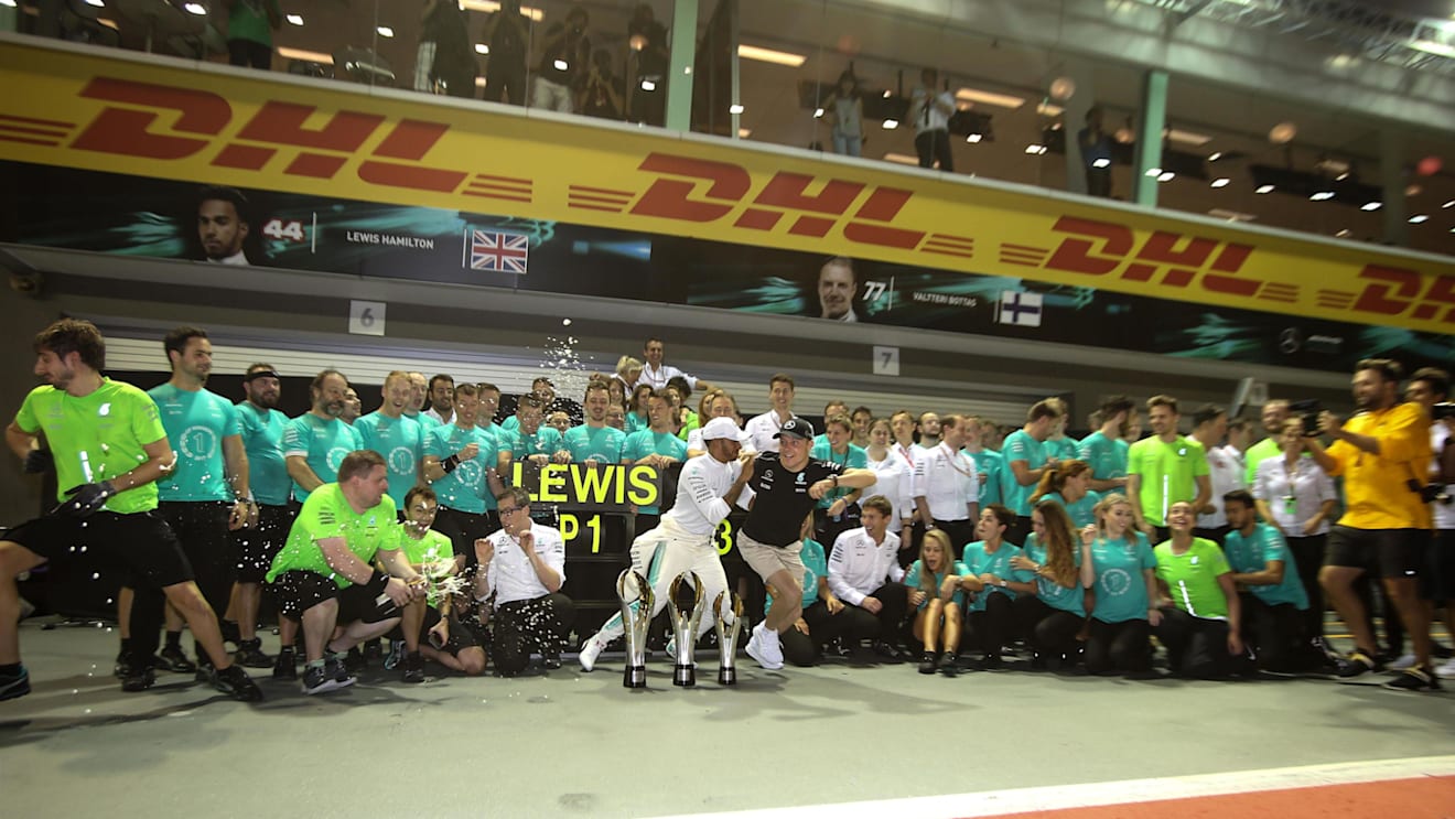 Race winner Lewis Hamilton (GBR) Mercedes AMG F1 celebrates with Valtteri Bottas (FIN) Mercedes AMG F1 and the team at Formula One World Championship, Rd14, Singapore Grand Prix, Race, Marina Bay Street Circuit, Singapore, Sunday 17 September 2017. © Mirko Stange/Sutton Images