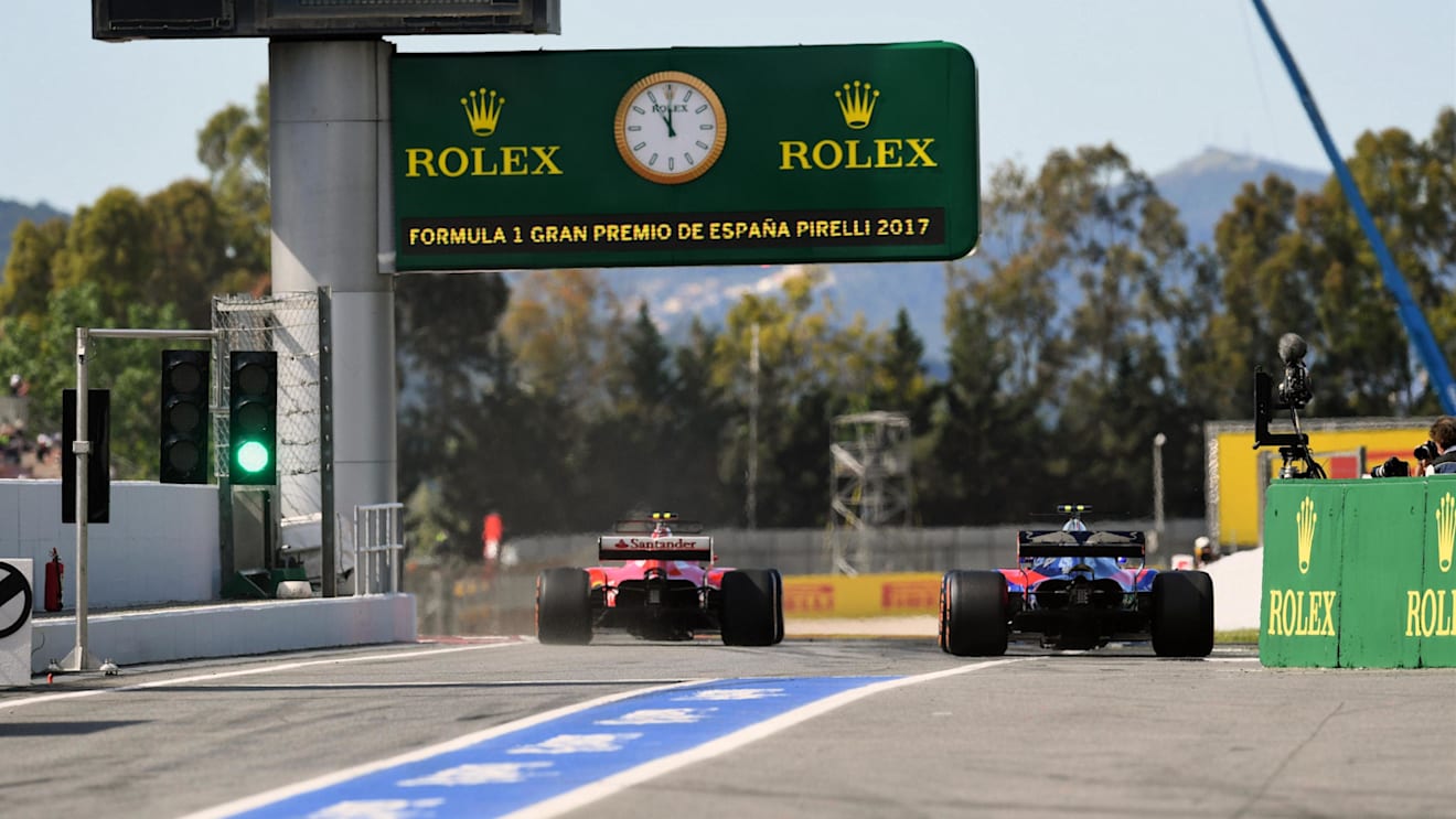 Carlos Sainz (ESP) Scuderia Toro Rosso STR12 and Kimi Raikkonen (FIN) Ferrari SF70-H at Formula One World Championship, Rd5, Spanish Grand Prix, Qualifying, Barcelona, Spain, Saturday 13 May 2017. © Sutton Motorsport Images