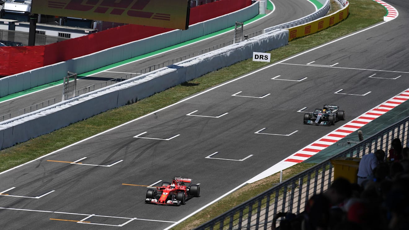Sebastian Vettel (GER) Ferrari SF70-H and Lewis Hamilton (GBR) Mercedes-Benz F1 W08 Hybrid battle for position at Formula One World Championship, Rd5, Spanish Grand Prix, Race, Barcelona, Spain, Sunday 14 May 2017. © Sutton Motorsport Images