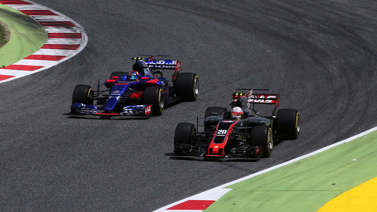 Carlos Sainz (ESP) Scuderia Toro Rosso STR12 and Kevin Magnussen (DEN) Haas VF-17 battle at Formula One World Championship, Rd5, Spanish Grand Prix, Race, Barcelona, Spain, Sunday 14 May 2017. © Sutton Motorsport Images