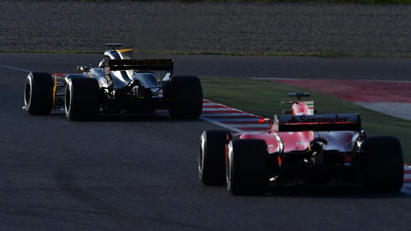 Nico Hulkenberg (GER) Renault Sport F1 Team RS17 and Sebastian Vettel (GER) Ferrari SF70-H at Formula One Testing, Day One, Barcelona, Spain, 27 February 2017. © Sutton Images
