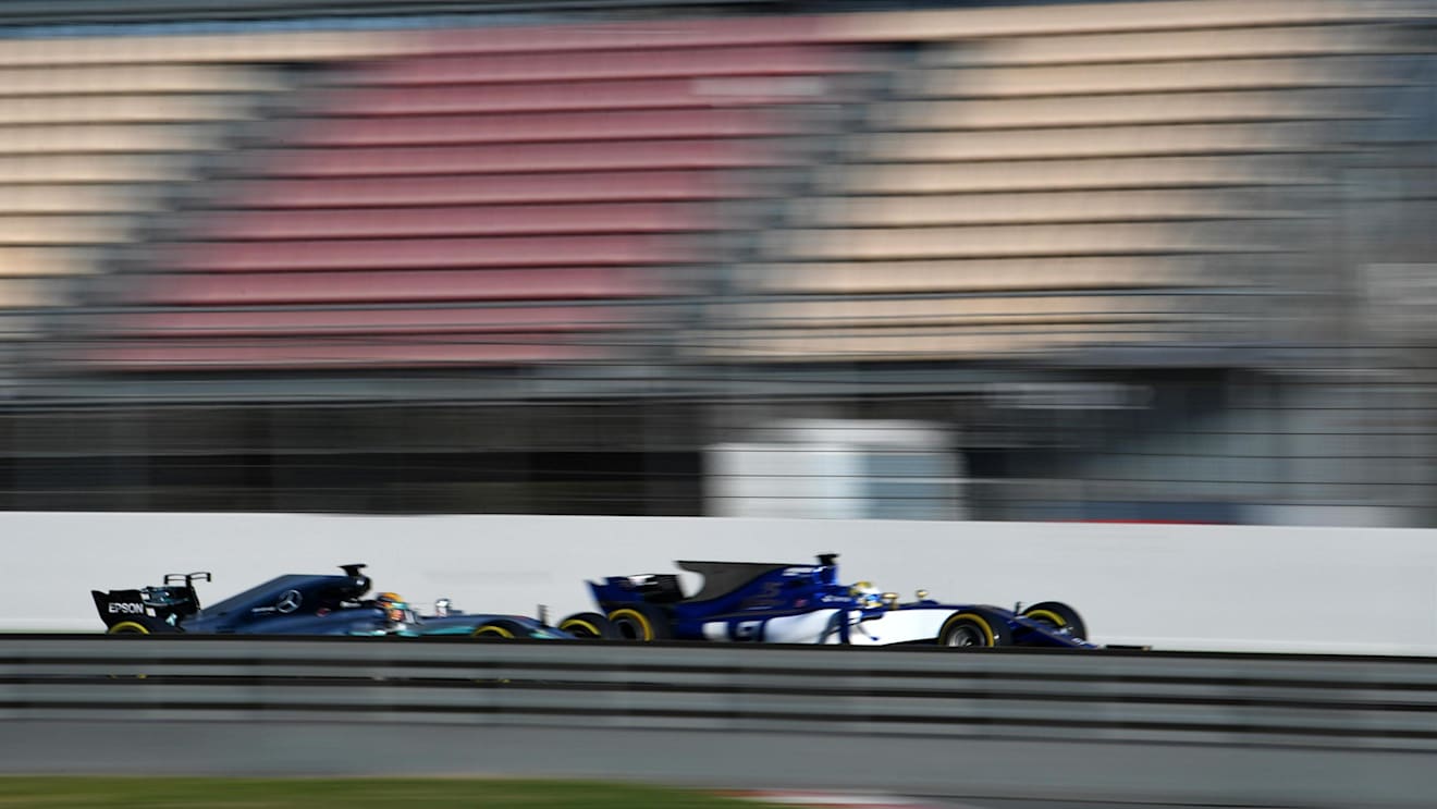 Marcus Ericsson (SWE) Sauber C36 and Lewis Hamilton (GBR) Mercedes-Benz F1 W08 Hybrid at Formula One Testing, Day Three, Barcelona, Spain, 1 March 2017. © Sutton Images