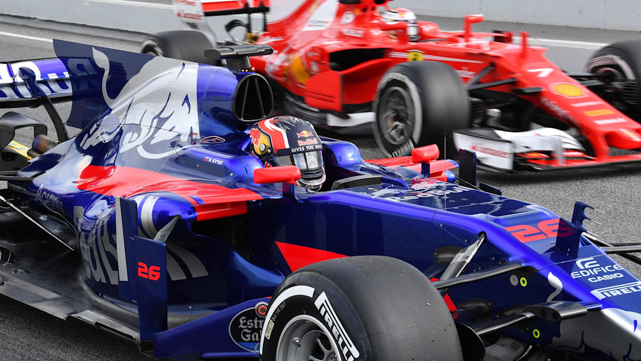 Kimi Raikkonen (FIN) Ferrari SF70-H passes Daniil Kvyat (RUS) Scuderia Toro Rosso STR12 at Formula One Testing, Day Two, Barcelona, Spain, 28 February 2017. © Sutton Images