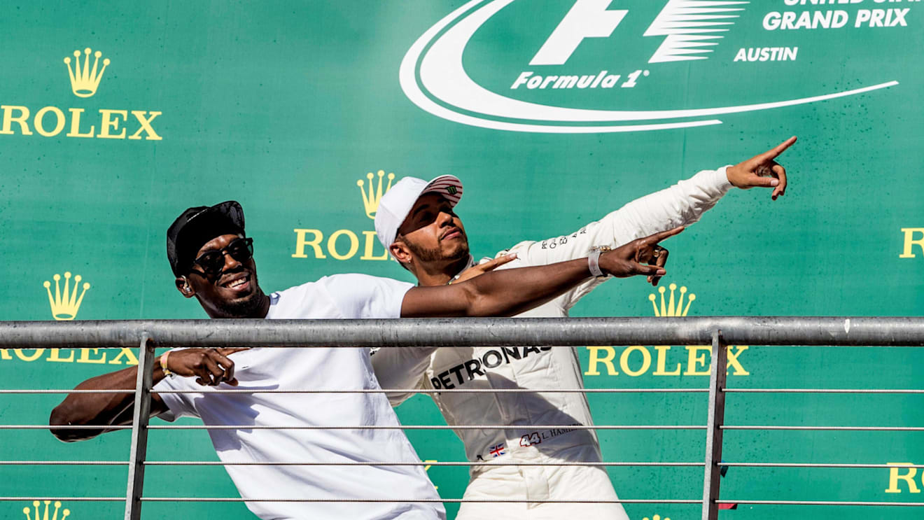 Usain Bolt (JAM) and race winner Lewis Hamilton (GBR) Mercedes AMG F1 celebrate on the podium at Formula One World Championship, Rd17, United States Grand Prix, Race, Circuit of the Americas, Austin, Texas, USA, Sunday 22 October 2017. © Manuel Goria/Sutton Images