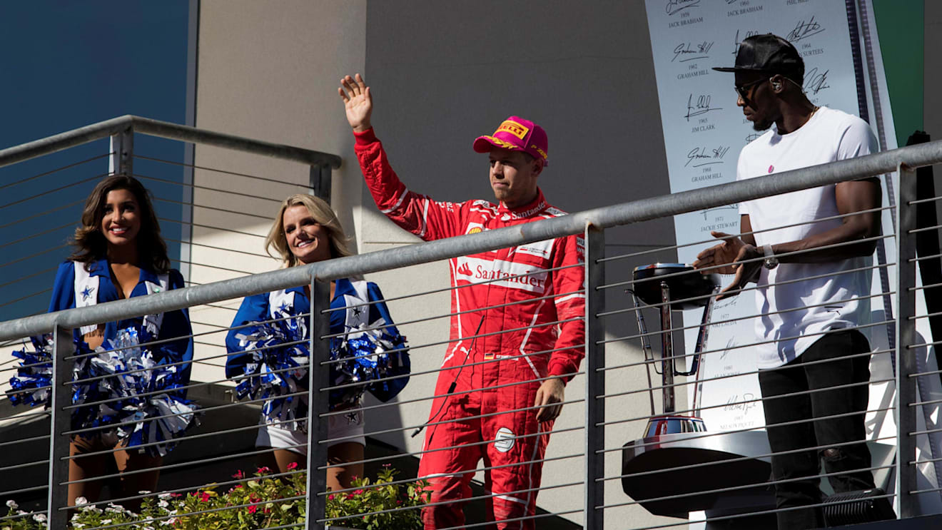 Sebastian Vettel (GER) Ferrari and Usain Bolt (JAM) celebrate on the podium at Formula One World Championship, Rd17, United States Grand Prix, Race, Circuit of the Americas, Austin, Texas, USA, Sunday 22 October 2017. © Manuel Goria/Sutton Images