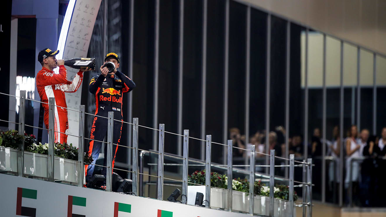 Sebastian Vettel, Ferrari and Max Verstappen, Red Bull Racing celebrate on the podium at Formula One World Championship, Rd21, Abu Dhabi Grand Prix, Race, Yas Marina Circuit, Abu Dhabi, UAE, Sunday 25 November 2018.