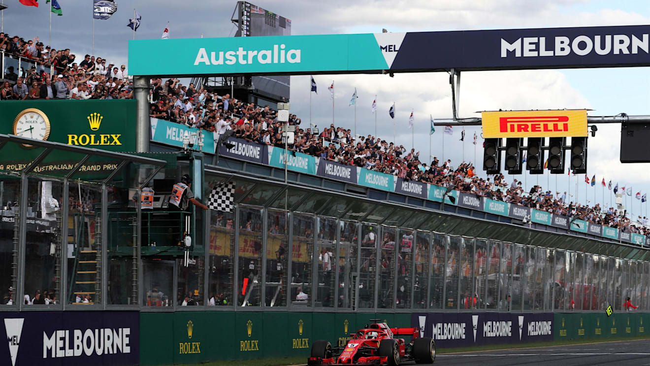 Race winner Sebastian Vettel (GER) Ferrari SF-71H crosses the line and takes the chequered flag at Formula One World Championship, Rd1, Australian Grand Prix, Race, Melbourne, Australia, Sunday 25 March 2018. © Dirk Klynsmith/Sutton Images