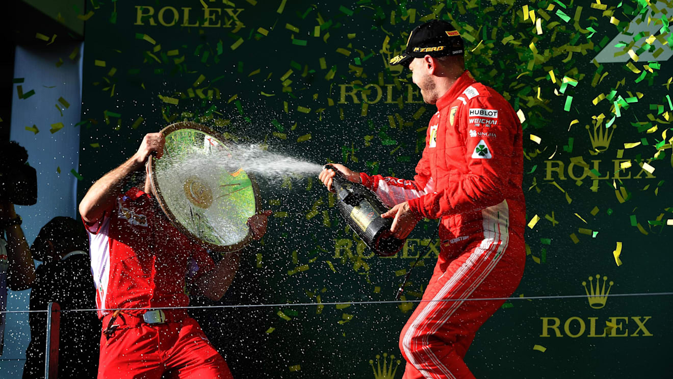 Race winner Sebastian Vettel (GER) Ferrari celebrates with the champagne on the podium at Formula One World Championship, Rd1, Australian Grand Prix, Race, Melbourne, Australia, Sunday 25 March 2018. © Mark Sutton/Sutton Images